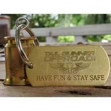 Load image into Gallery viewer, brass bell made of a .50 cal shell with brass tag that says "Have fun & stay safe"