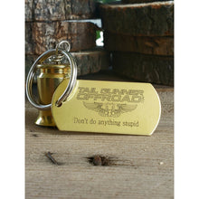 Load image into Gallery viewer, brass bell made of a .50 cal shell with brass tag that says "don't do anythig stupid"