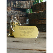 Load image into Gallery viewer, brass bell made of a .50 cal shell with brass tag that says &quot;Eat, Sleep, Ride&quot;
