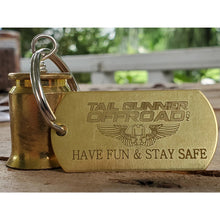 Load image into Gallery viewer, brass bell made of a .50 cal shell with brass tag that says &quot;Have fun &amp; stay safe&quot;
