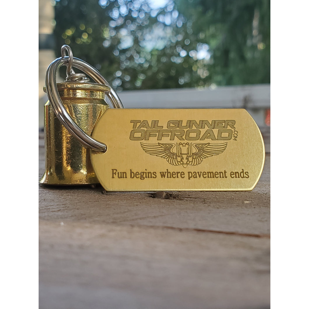 brass bell made of a .50 cal shell with brass tag that says 